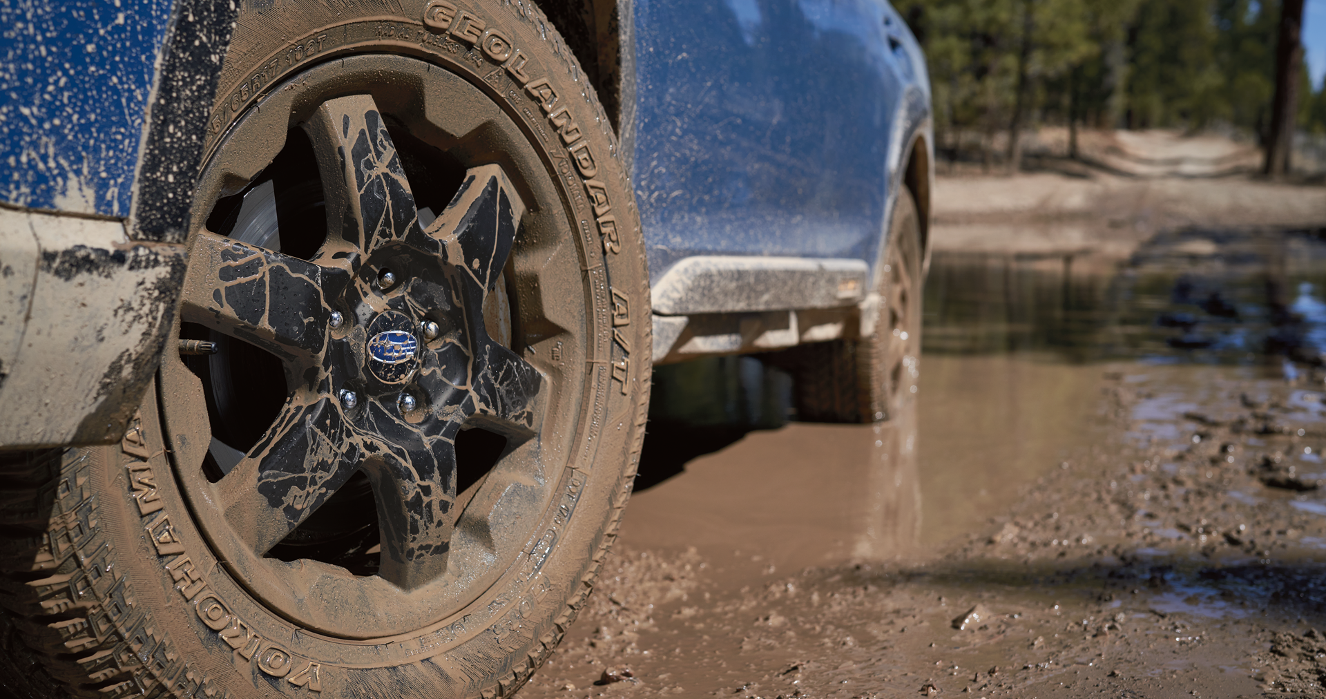 A close-up of the 17-inch off-road wheels and all-terrain Yokohama GEOLANDAR® tires on the 2023 Outback Wilderness. | Subaru of Utica in Yorkville NY