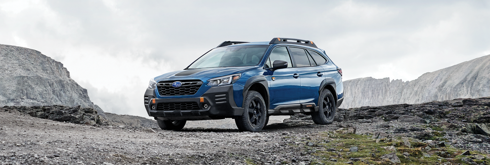 A 2023 Outback Wilderness parked in the mountains. | Subaru of Utica in Yorkville NY